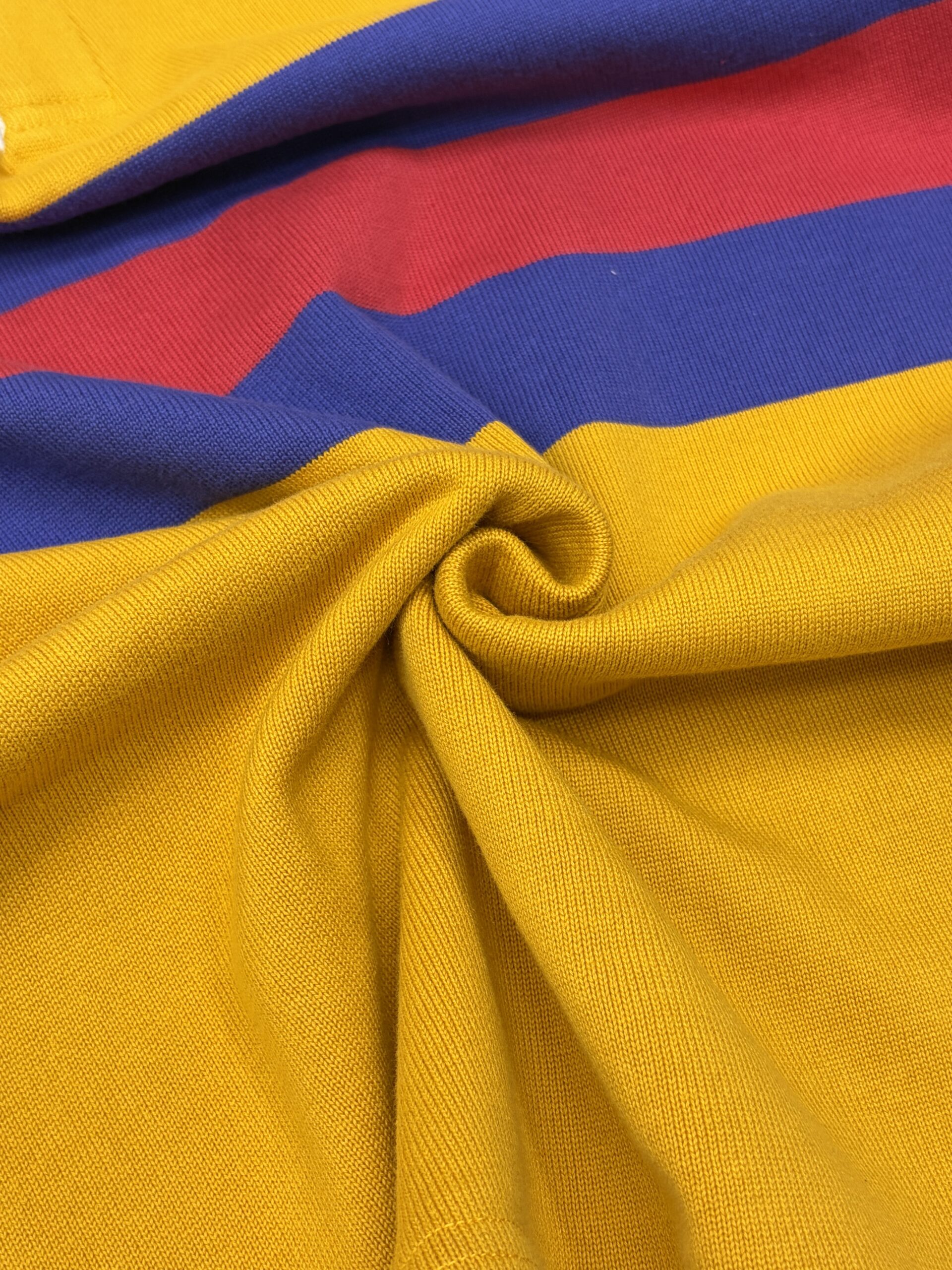 Close-up of custom rugby shirt twill texture fabric for OEM teamwear