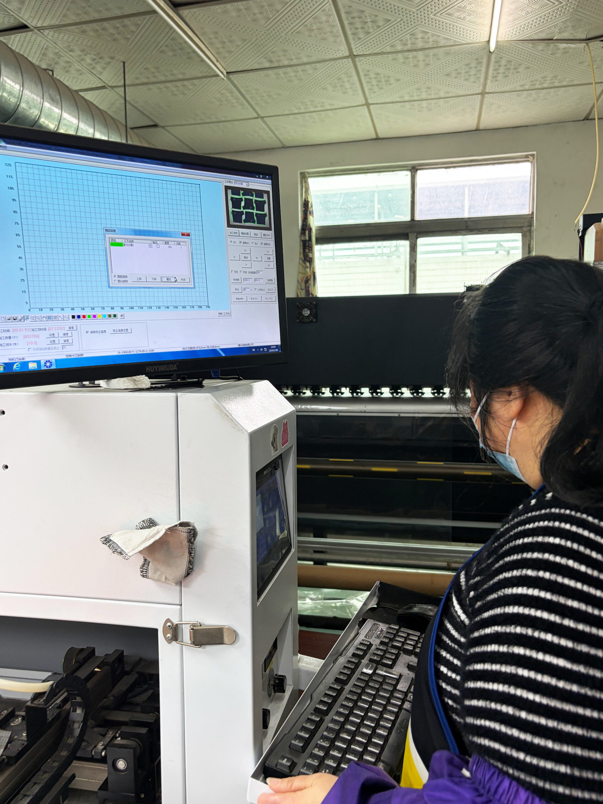 sportswear factory technician using CAD software for pattern making and quality control